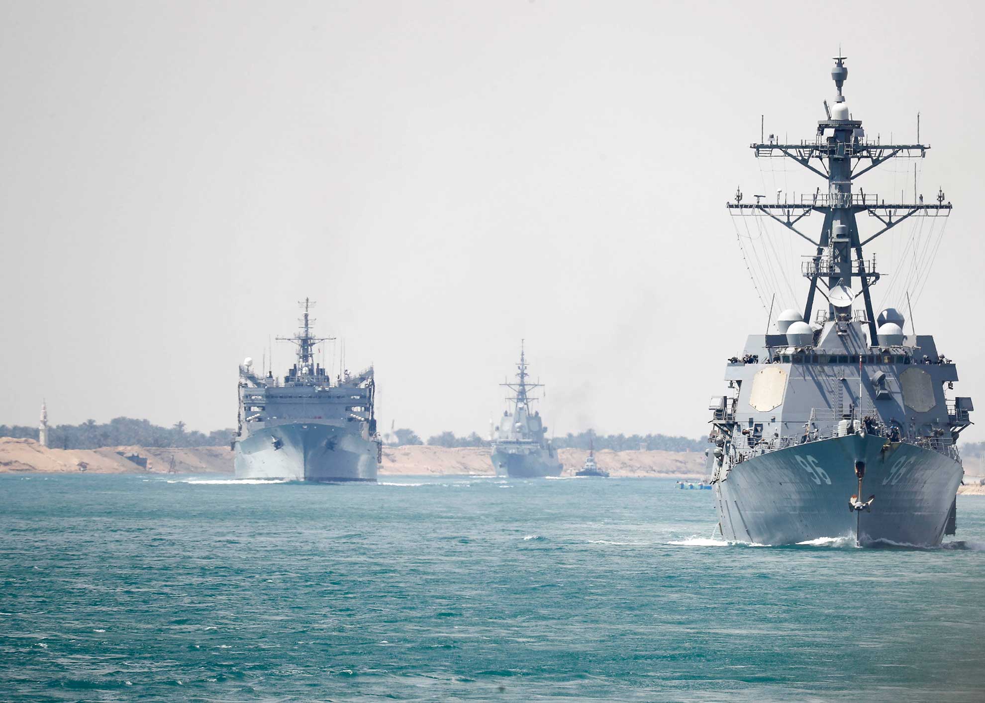 Suez Canal (May 9, 2019) The Abraham Lincoln Carrier Strike Group transits the Suez Canal. The Abraham Lincoln Carrier Strike Group (ABECSG) is deployed to the U.S. Central Command area of responsibility in order to defend American forces and interests in the region. With Abraham Lincoln as the flagship, deployed strike group assets include staffs, ships and aircraft of Carrier Strike Group 12 (CSG 12), Destroyer Squadron 2 (DESRON 2), USS Leyte Gulf (CG 55) and Carrier Air Wing 7 (CVW 7); as well as the Spanish navy lvaro de Bazan-class frigate ESPS Mendez Nñez (F 104) -- U.S. Navy photo by MCS 3rd Class Darion Chanelle Triplett. -