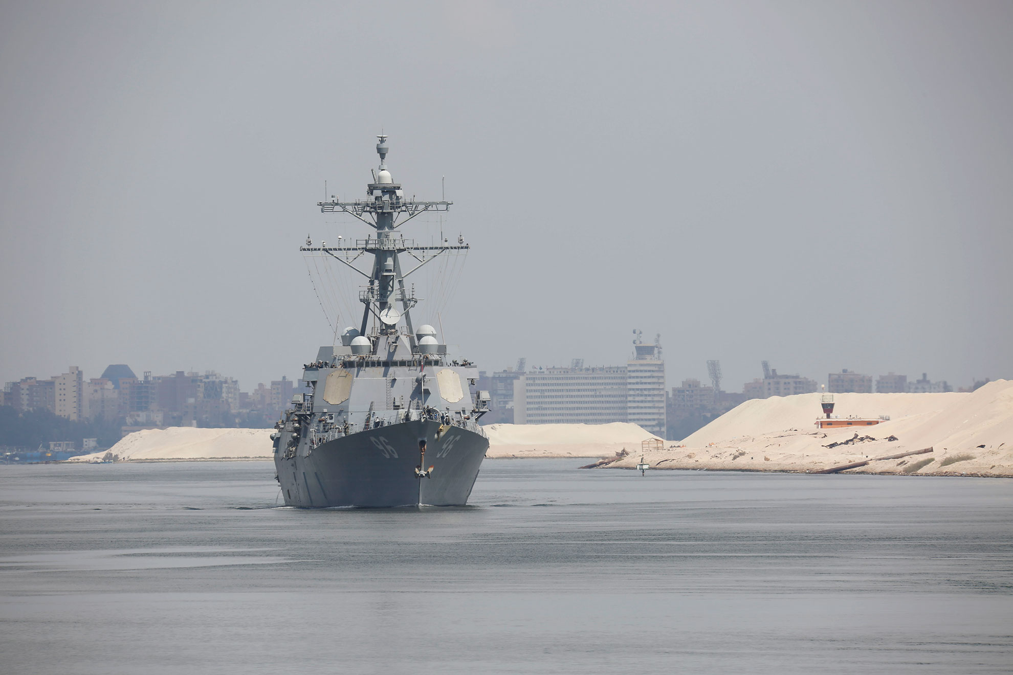 Suez Canal (May 9, 2019) The Arleigh Burke-class guided-missile destroyer USS Bainbridge (DDG 96) transits the Suez Canal. The Abraham Lincoln Carrier Strike Group (ABECSG) is deployed to the U.S. Central Command area of responsibility in order to defend American forces and interests in the region. With Abraham Lincoln as the flagship, deployed strike group assets include staffs, ships and aircraft of Carrier Strike Group 12 (CSG 12), Destroyer Squadron 2 (DESRON 2), USS Leyte Gulf (CG 55) and Carrier Air Wing 7 (CVW 7); as well as the Spanish navy lvaro de Bazan-class frigate ESPS Mendez Nñez (F 104) -- US Navy photo by MCS Seaman Michael Singley. -